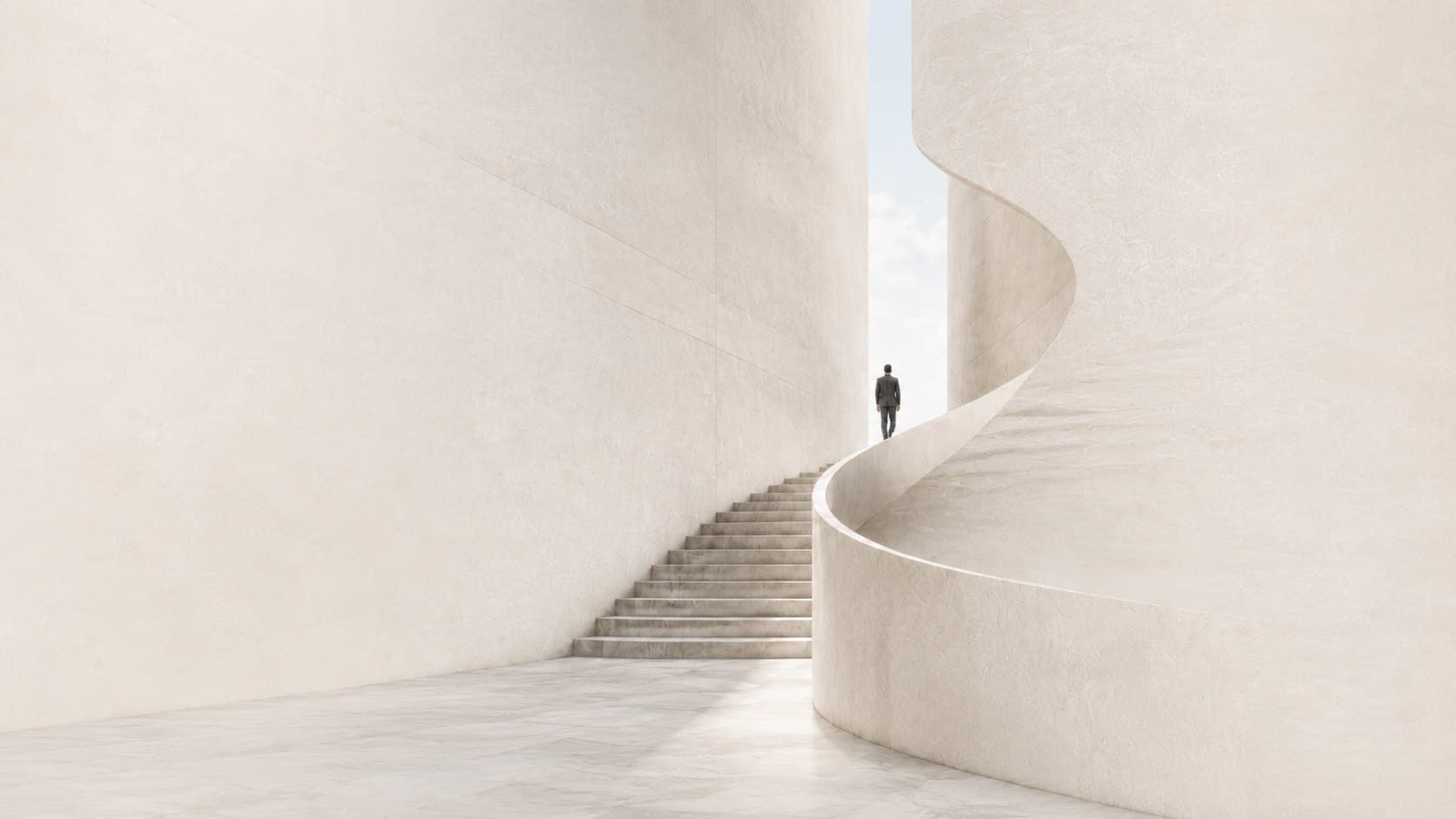 A figure ascending a sculptural cream spiral staircase